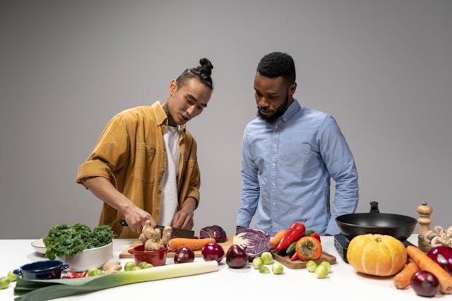 Two men preparing a whole foods meal for gut health optimization